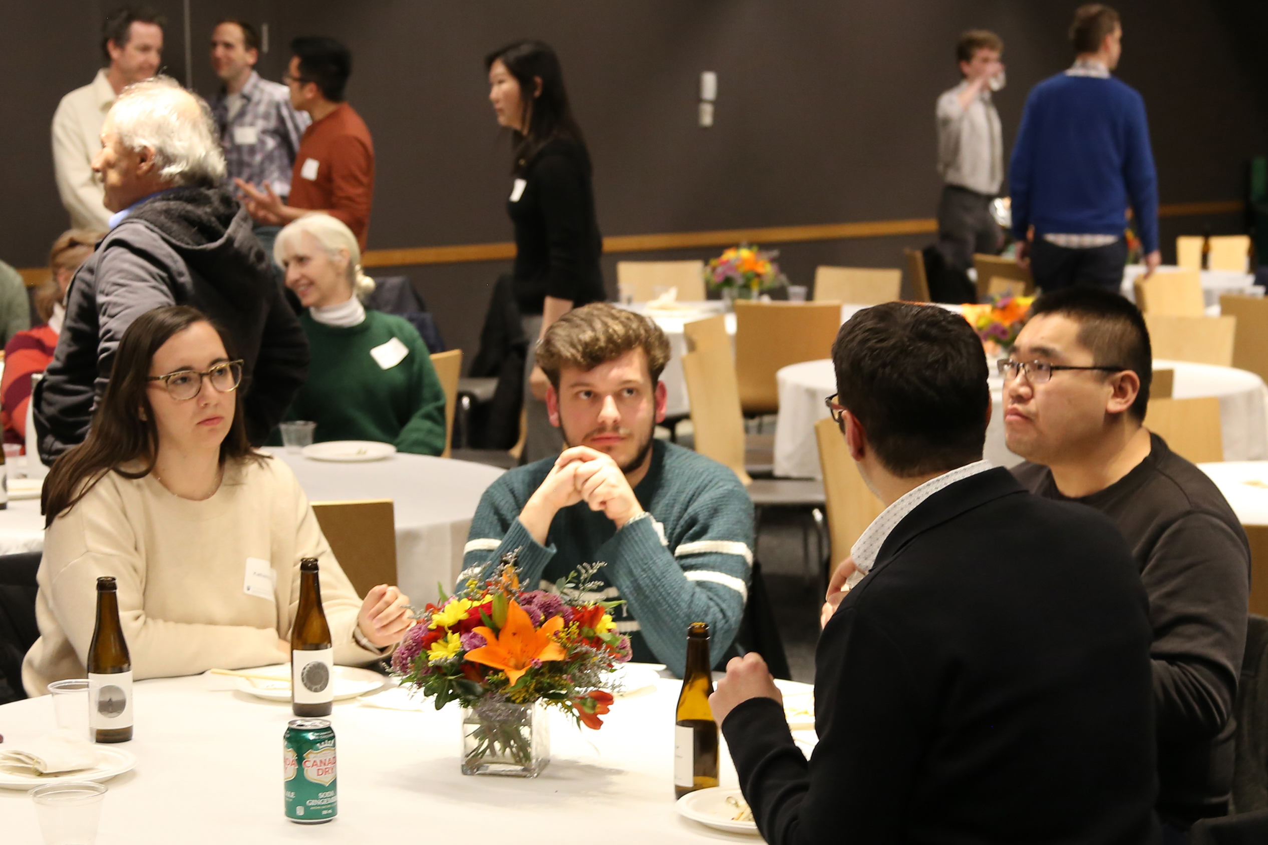 Attendees conversing at the 2023 Mark Zacher Lecture